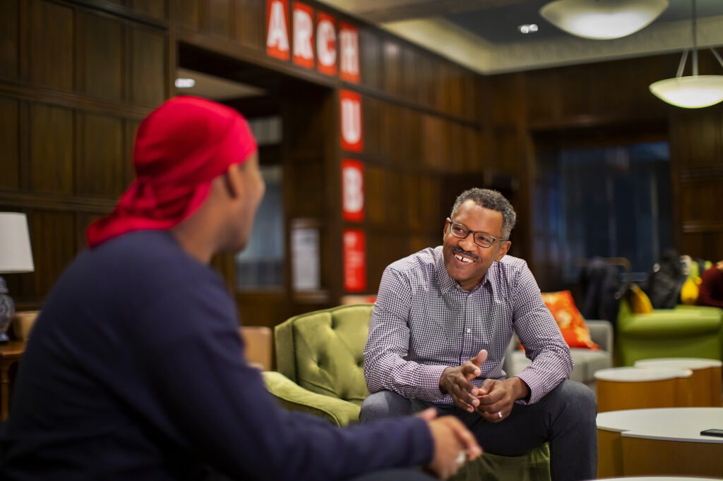 Brian Peterson talks with Adrian Evans IV in the ARCH building.