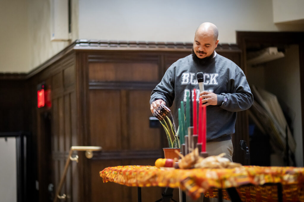 Chaz Howard poured out libations at Kwanzaa.